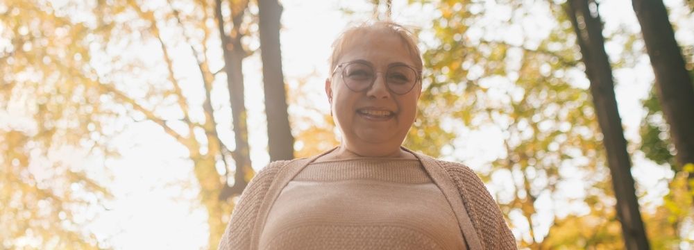 Happy woman, smiling in glowing light 